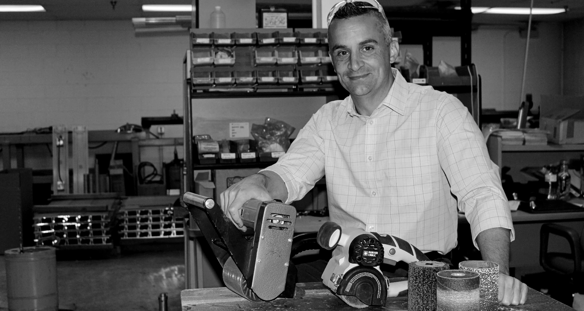 Robert Kundel Jr. in his workshop with an early RESTORER tool